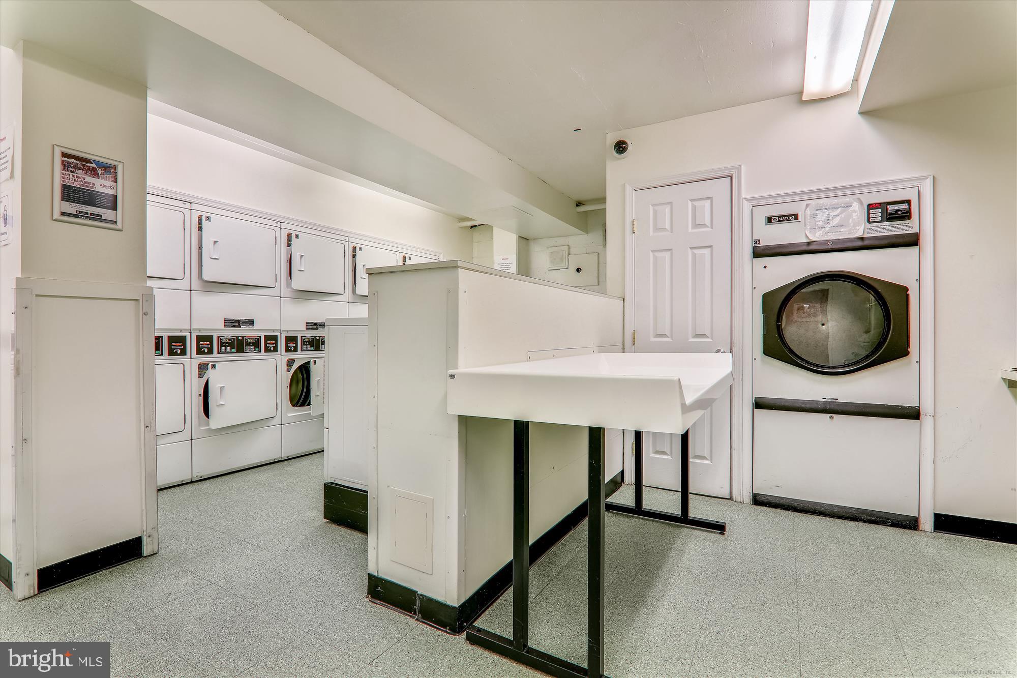 4000 Tunlaw Road Northwest, Unit 619 Washington, DC 20007 - Photo 32 of 39 a kitchen with stainless steel appliances a white refrigerator and a stove top oven