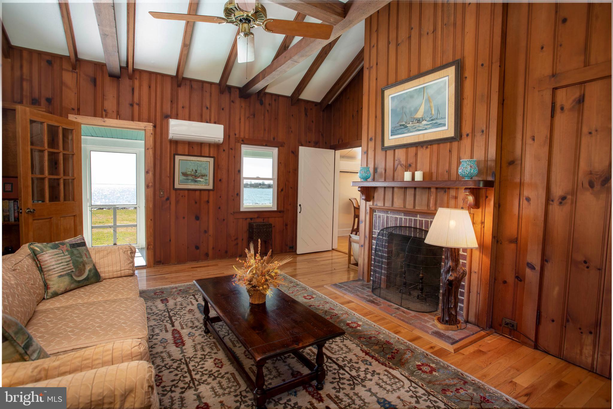26107 Goose Neck Road Royal Oak, MD 21662 - Photo 29 of 50 Charming carriage house living room w/ FP