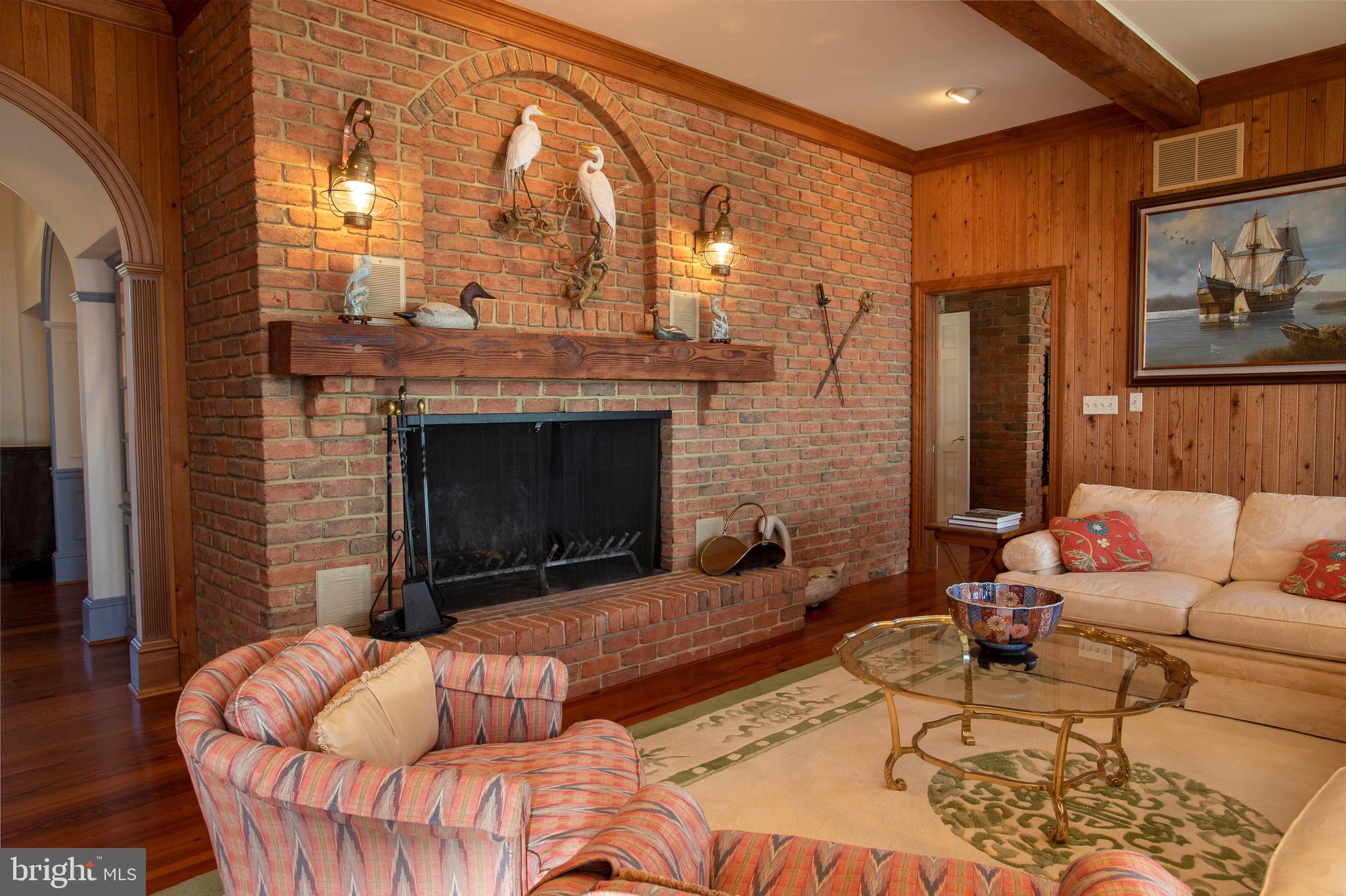 26107 Goose Neck Road Royal Oak, MD 21662 - Photo 10 of 50 Living room with double sized fireplace