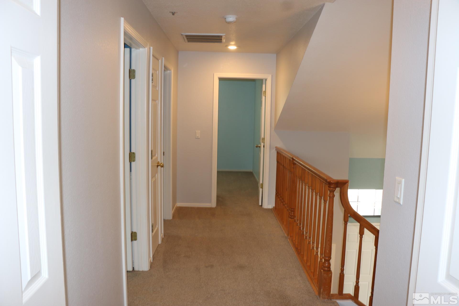 5330 Butterfly Court Reno, NV 89523 - Photo 16 of 34 a view of a hallway with a hallway