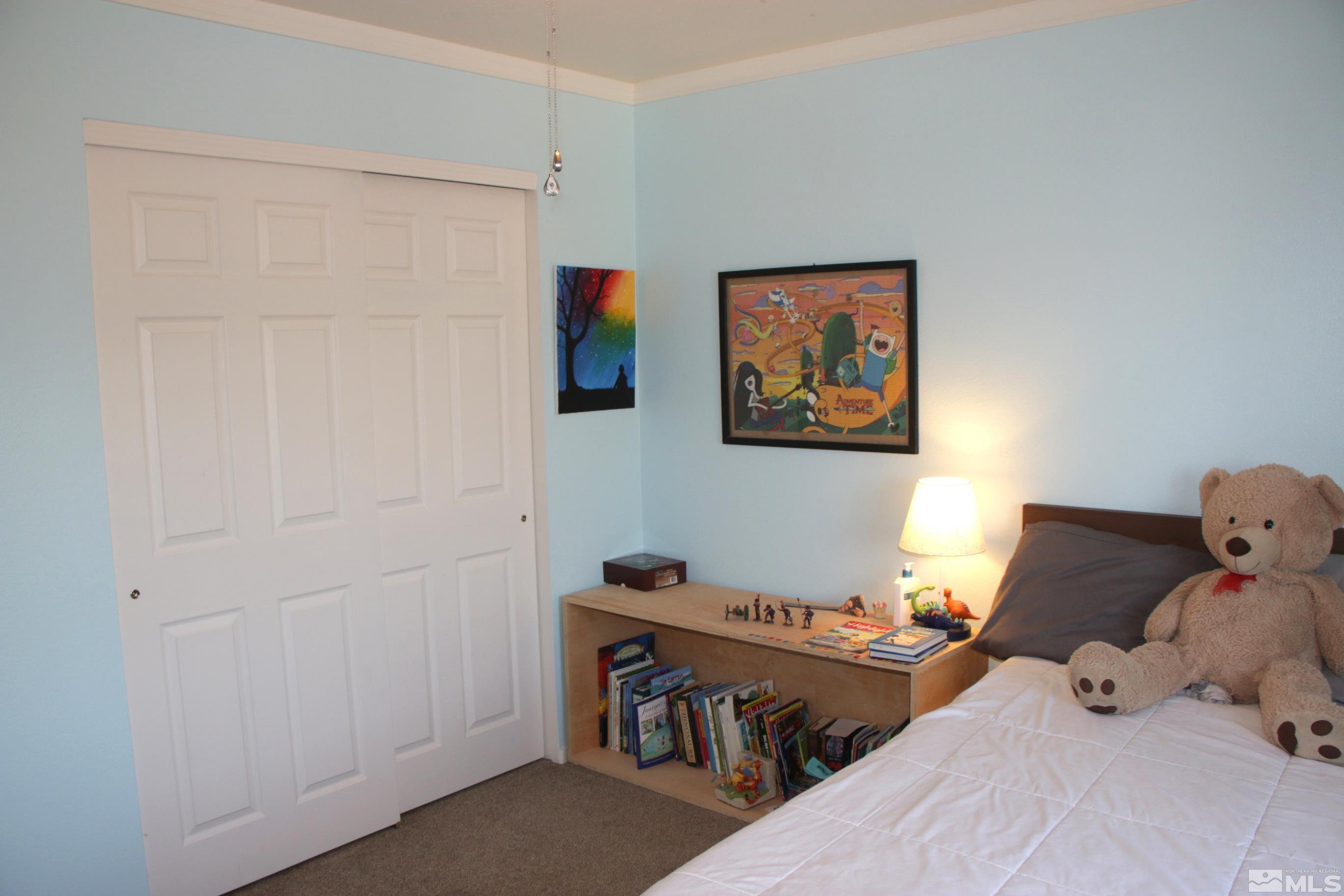 5330 Butterfly Court Reno, NV 89523 - Photo 17 of 34 a bedroom with bed and a window