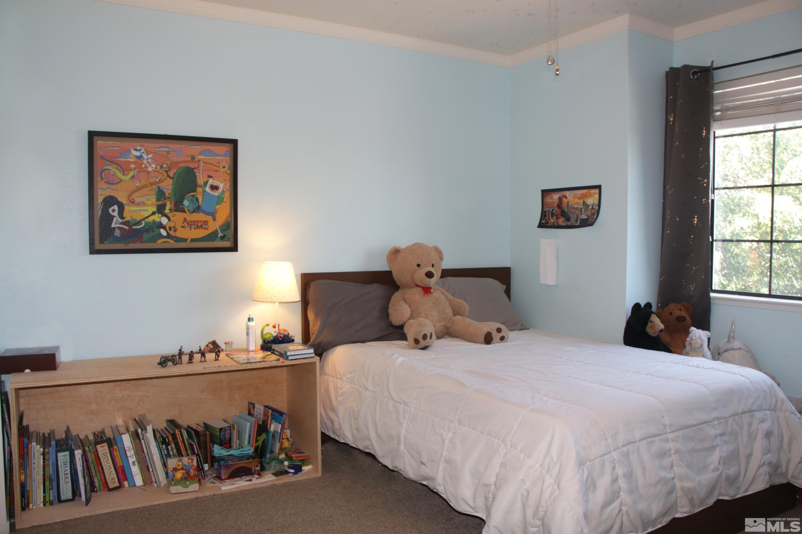 5330 Butterfly Court Reno, NV 89523 - Photo 18 of 34 a bedroom with a bed and a window