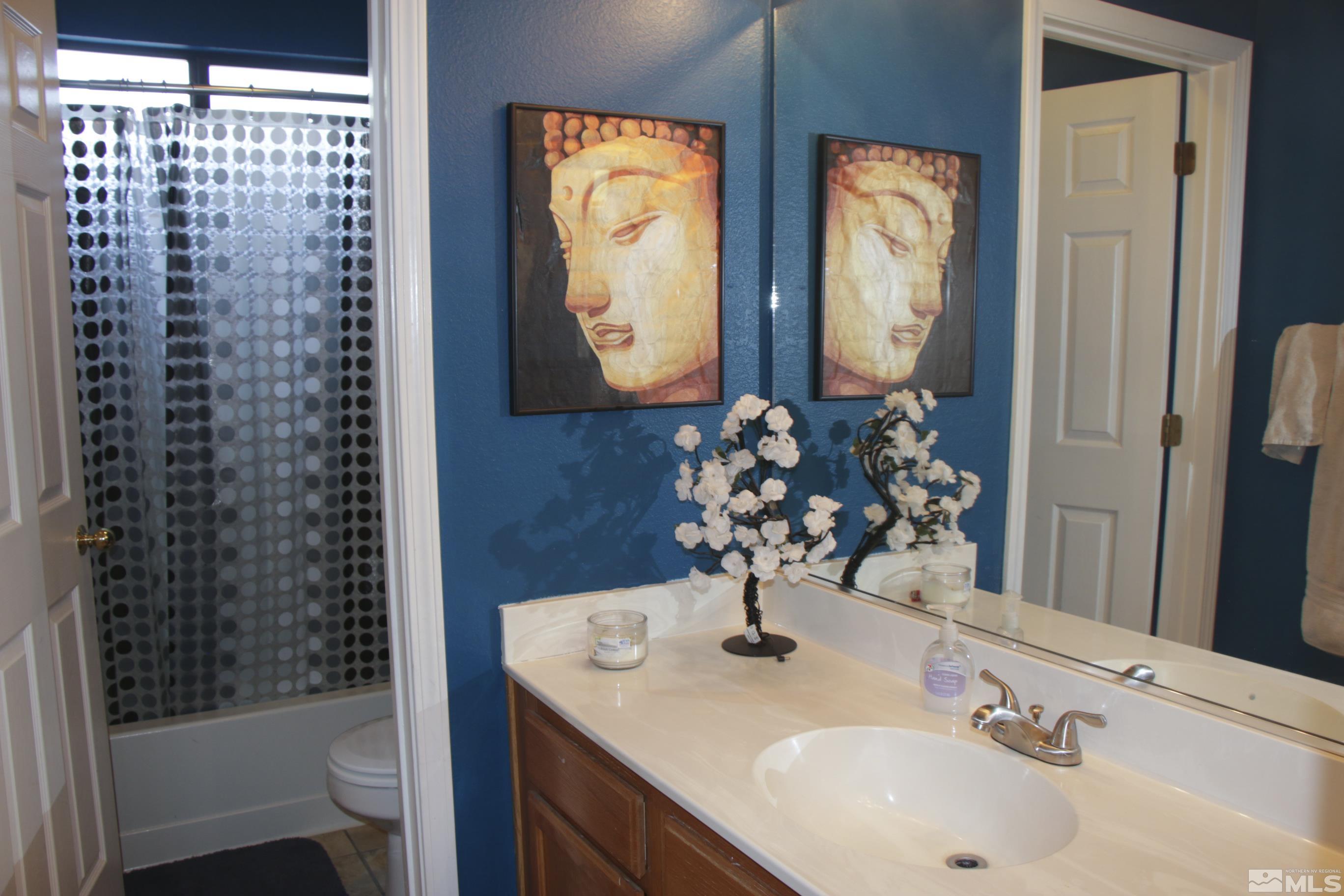 5330 Butterfly Court Reno, NV 89523 - Photo 19 of 34 a bathroom with a sink and a mirror