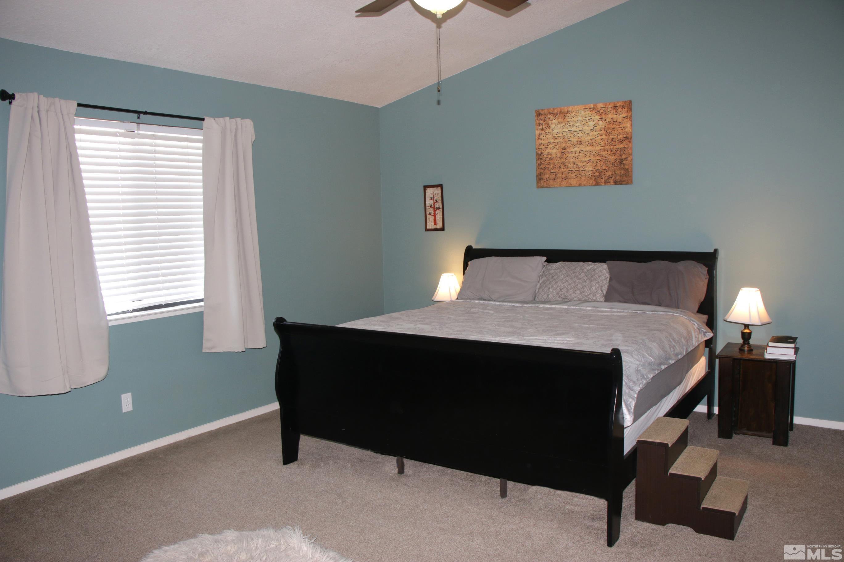 5330 Butterfly Court Reno, NV 89523 - Photo 23 of 34 a bedroom with a bed and a window