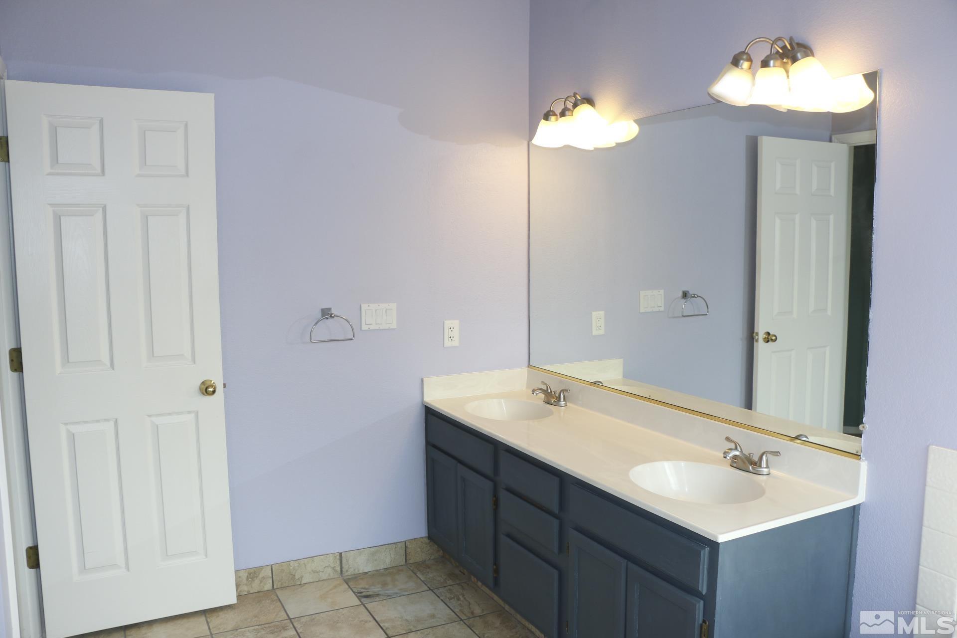 5330 Butterfly Court Reno, NV 89523 - Photo 27 of 34 a bathroom with a sink and a mirror