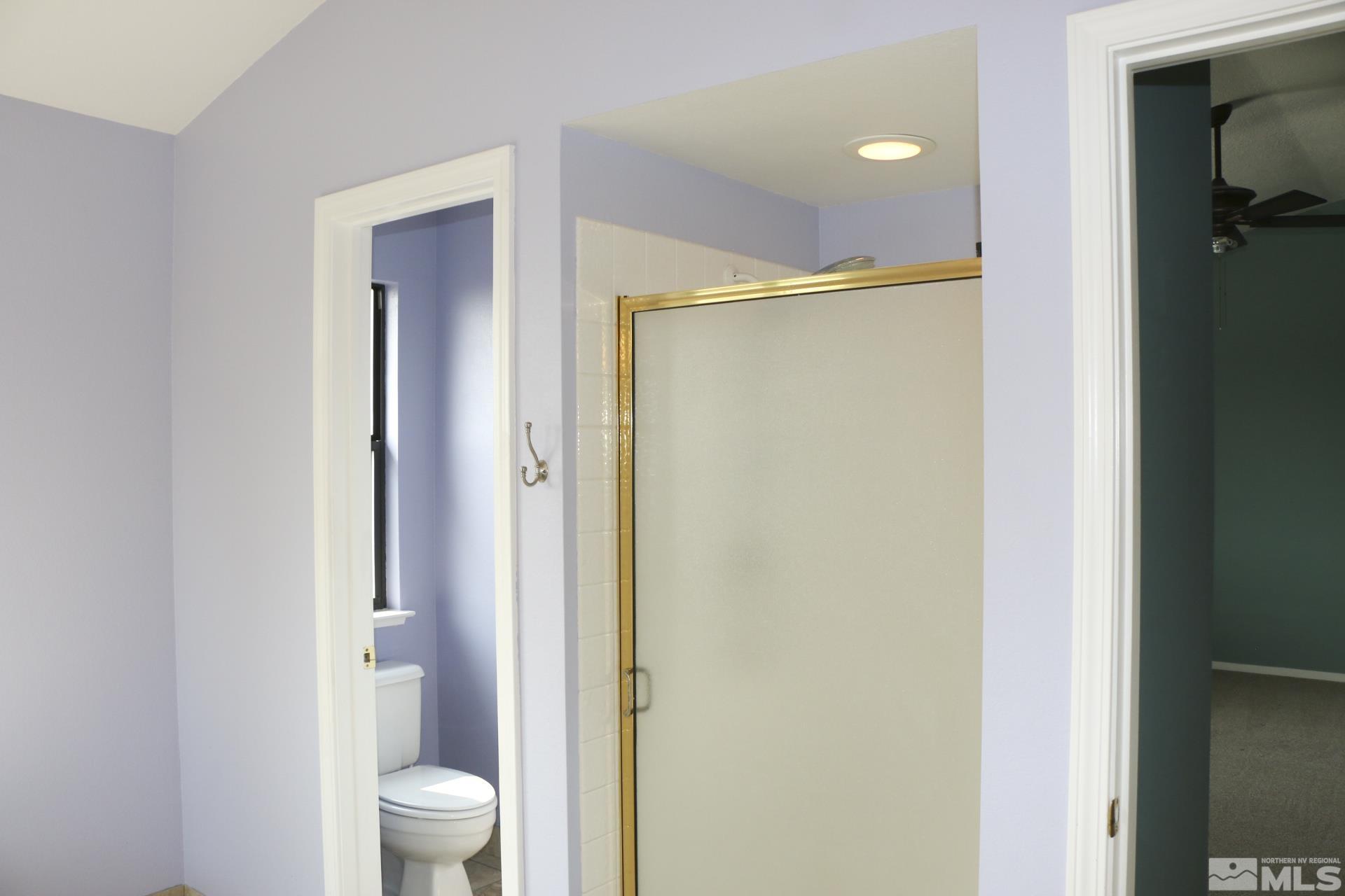 5330 Butterfly Court Reno, NV 89523 - Photo 28 of 34 a bathroom with a shower and a toilet