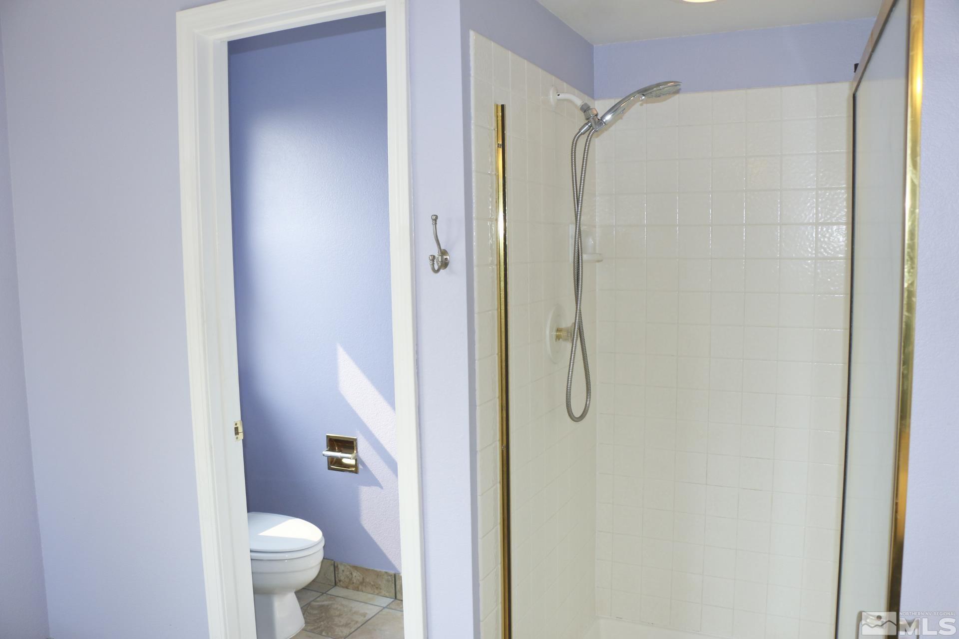 5330 Butterfly Court Reno, NV 89523 - Photo 29 of 34 a bathroom with a granite countertop shower