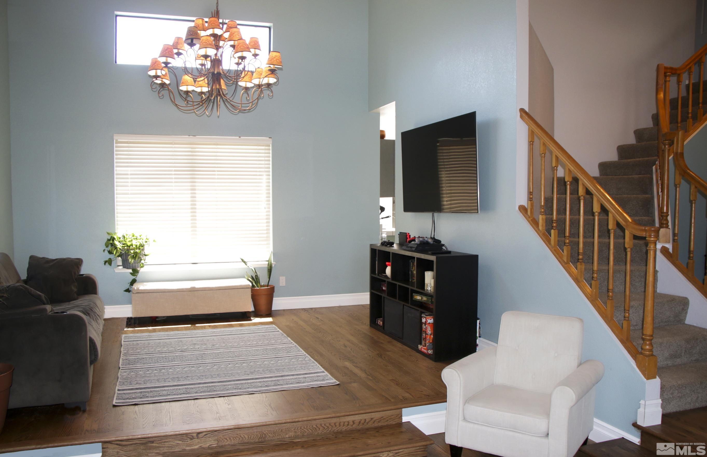 5330 Butterfly Court Reno, NV 89523 - Photo 3 of 34 a living room with furniture and a flat screen tv