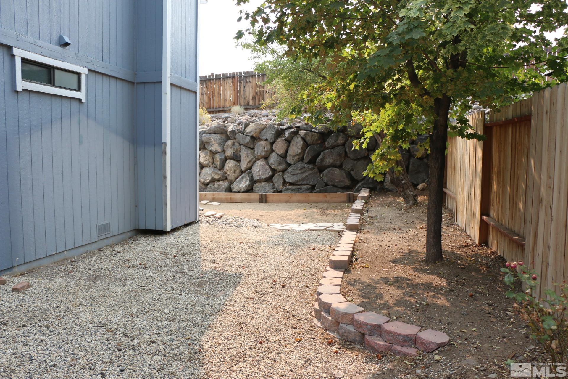 5330 Butterfly Court Reno, NV 89523 - Photo 33 of 34 a view of a yard with wooden fence