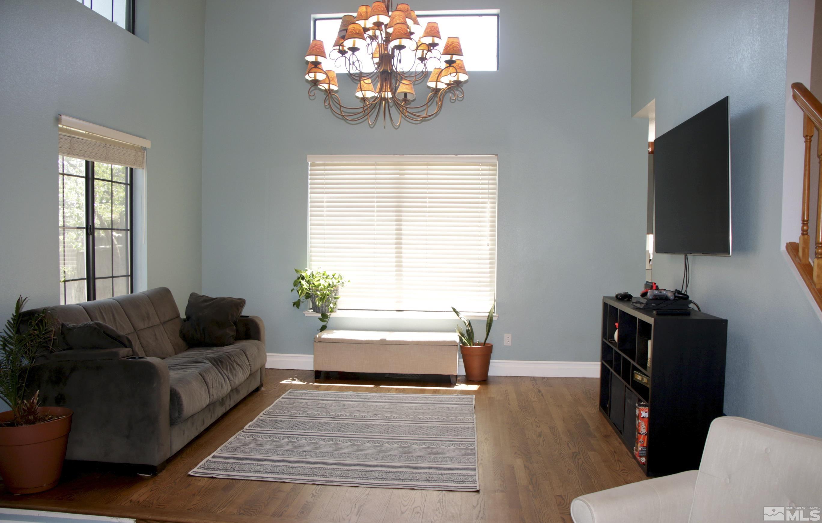 5330 Butterfly Court Reno, NV 89523 - Photo 4 of 34 a living room with furniture and a flat screen tv