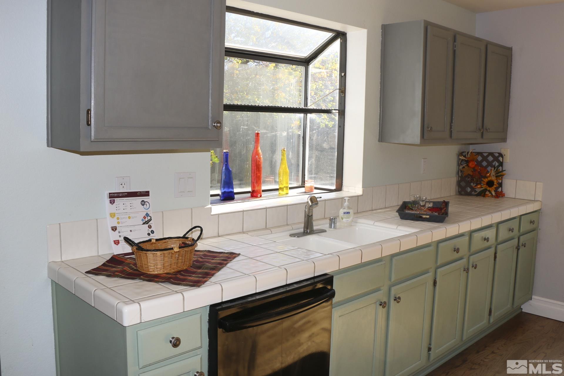 5330 Butterfly Court Reno, NV 89523 - Photo 9 of 34 a kitchen with a sink cabinets and window