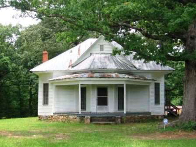 3076 Stokes Store Road Forsyth, GA 31029 - Photo 1 of 11 a front view of a house with a yard