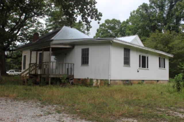 3076 Stokes Store Road Forsyth, GA 31029 - Photo 2 of 11 a front view of a house with garden
