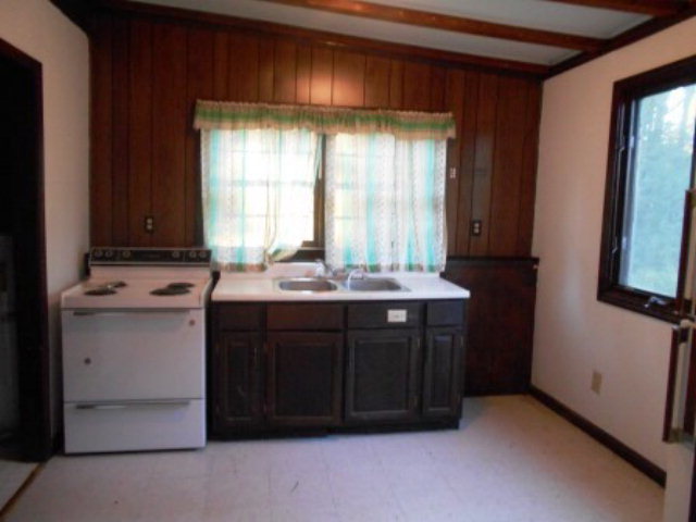 3076 Stokes Store Road Forsyth, GA 31029 - Photo 11 of 11 a bathroom with a sink and a mirror