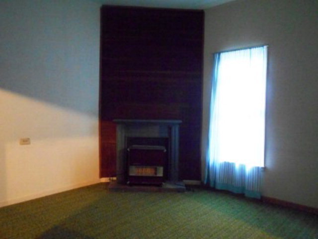 3076 Stokes Store Road Forsyth, GA 31029 - Photo 7 of 11 an empty room with windows