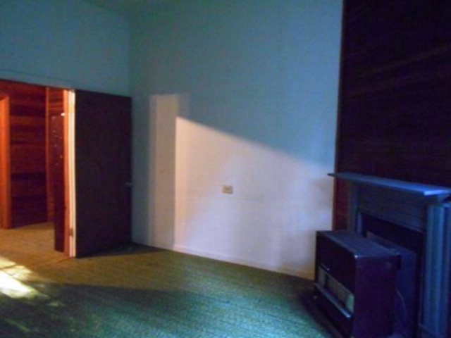 3076 Stokes Store Road Forsyth, GA 31029 - Photo 8 of 11 a view of an empty room with a fireplace