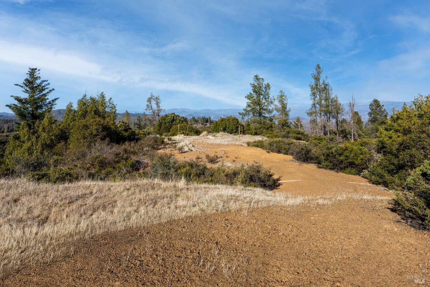 3681 Benmore Valley Road Hopland, CA 95449 - Photo 17 of 20 a view of a road with a building in the background
