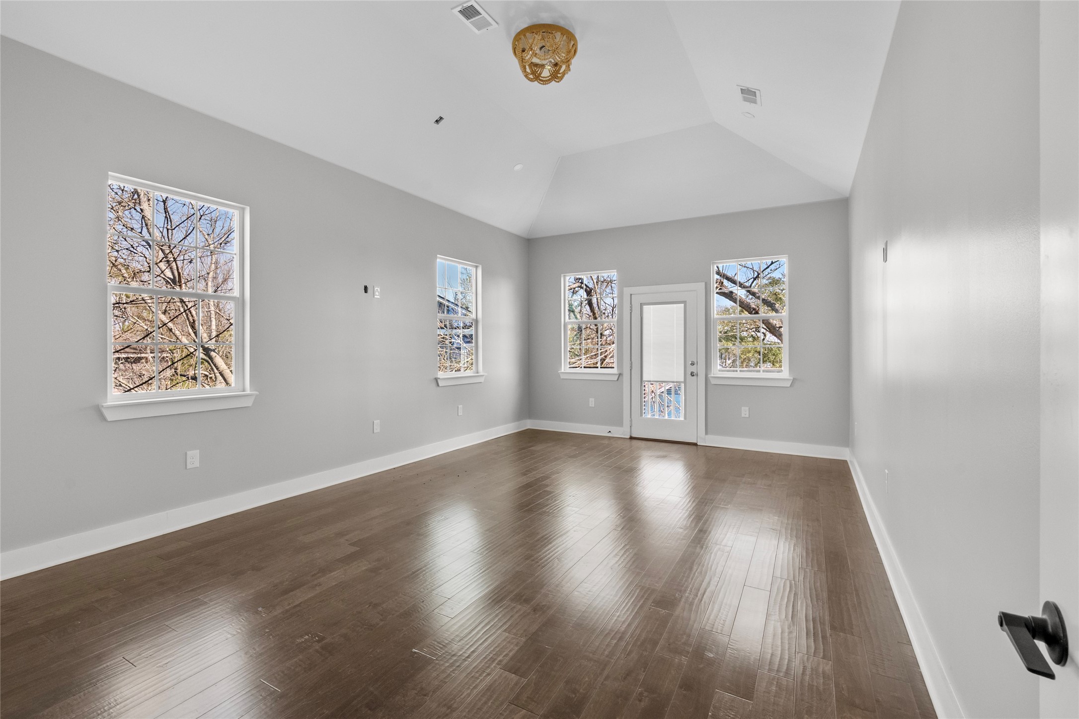 3133 Hamilton Street La Porte, TX 77571 - Photo 11 of 24 wooden floor in an empty room with a window