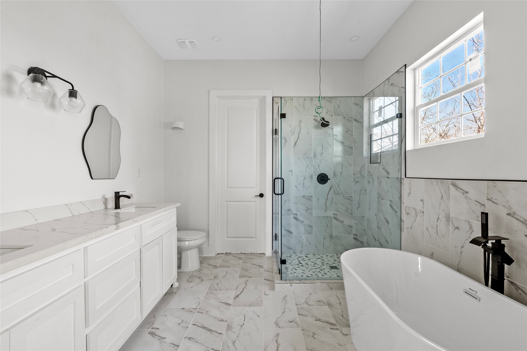 3133 Hamilton Street La Porte, TX 77571 - Photo 12 of 24 a bathroom with a sink a toilet and shower
