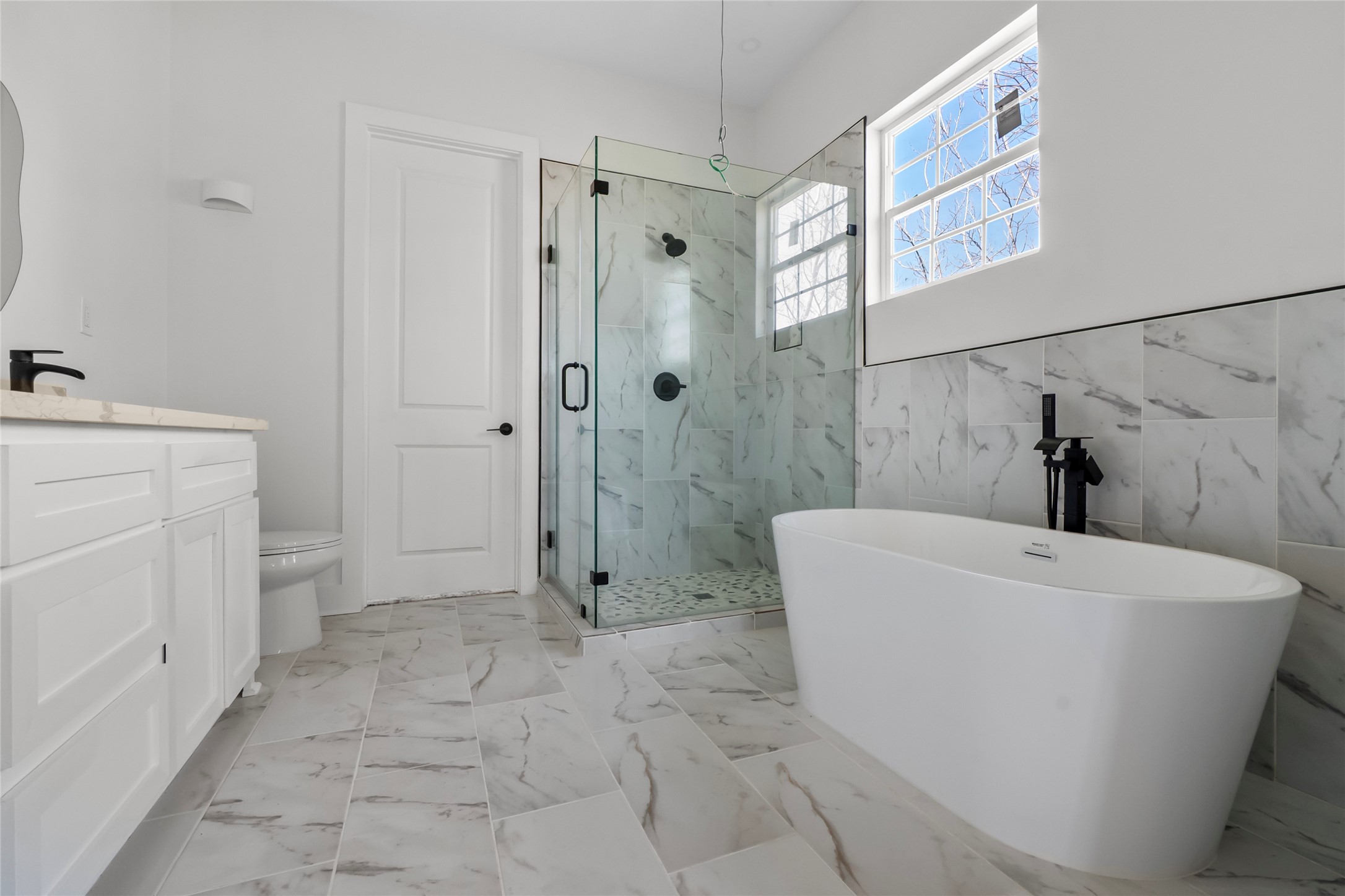 3133 Hamilton Street La Porte, TX 77571 - Photo 13 of 24 a white bath tub sitting next to a white sink