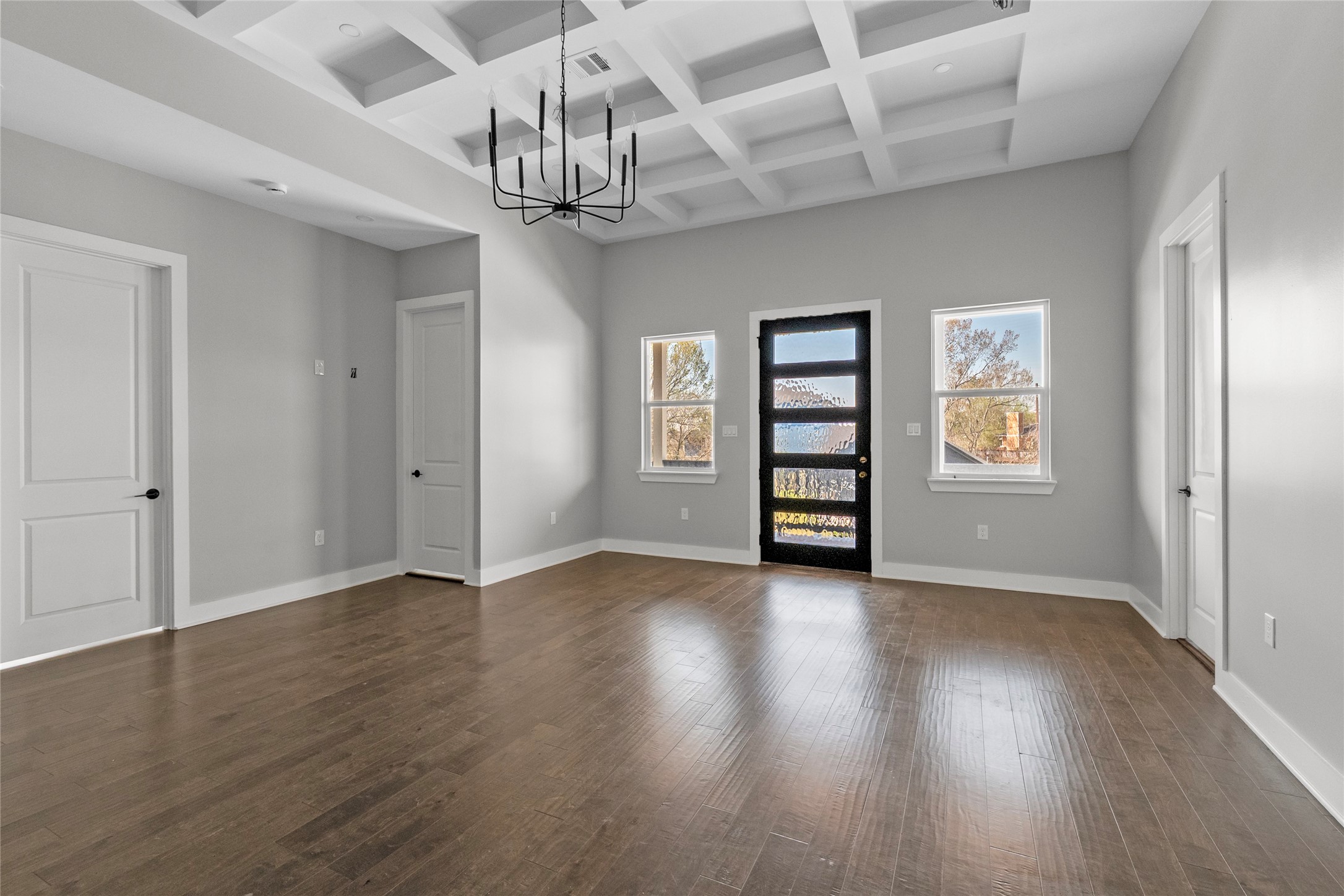 3133 Hamilton Street La Porte, TX 77571 - Photo 6 of 24 an empty room with wooden floor chandelier and windows
