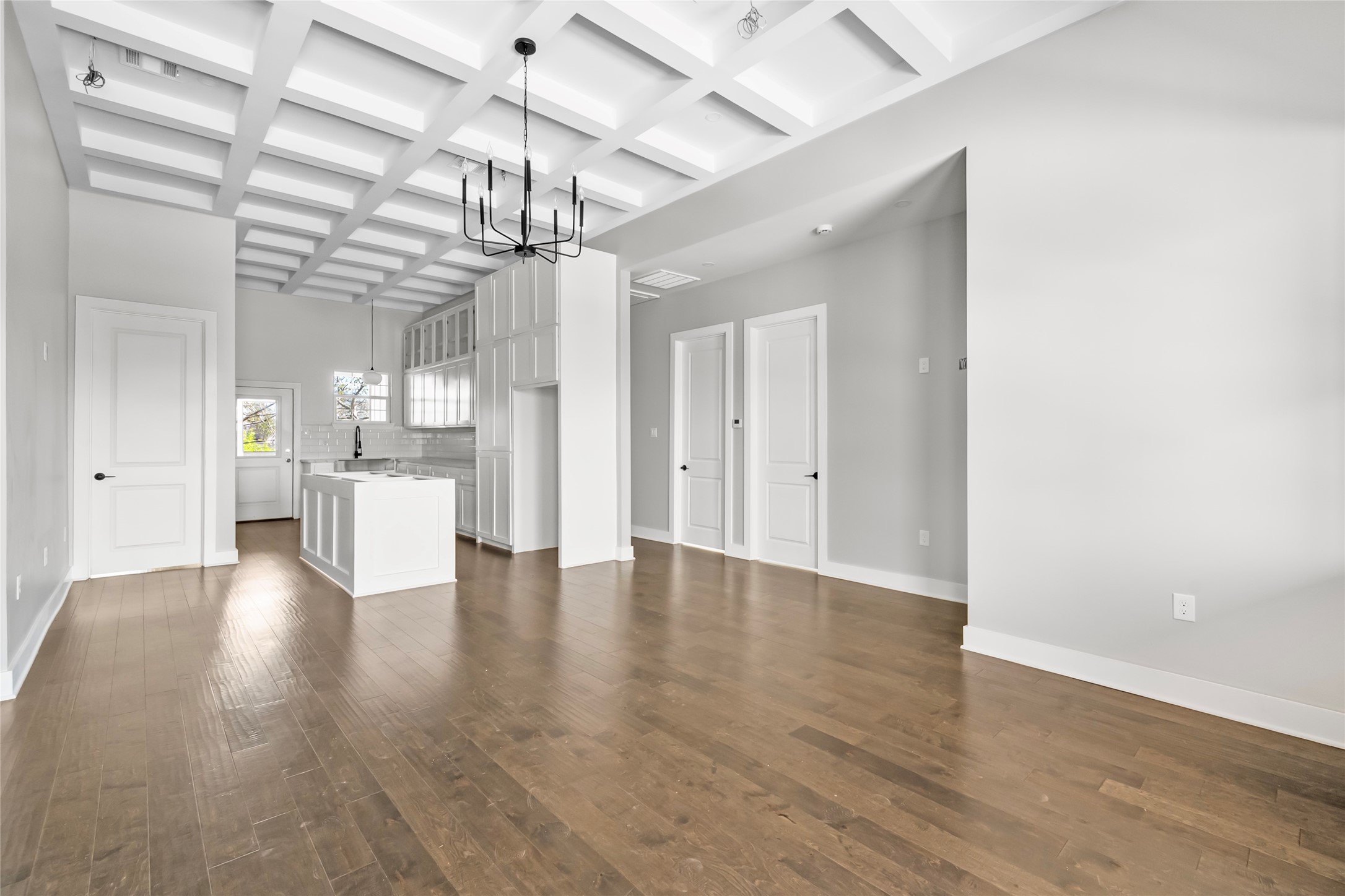 3133 Hamilton Street La Porte, TX 77571 - Photo 8 of 24 a view of a kitchen with a refrigerator and a wooden floor