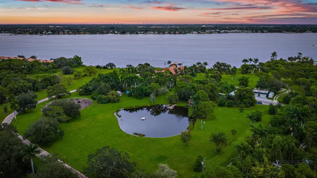 an aerial view of a house with a lake view