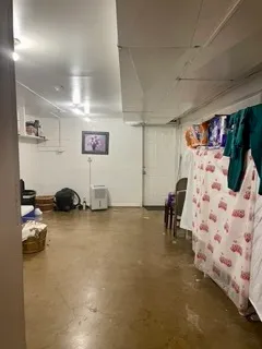 a view of a livingroom with furniture window and outside view