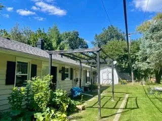 a backyard of a house with lots of green space