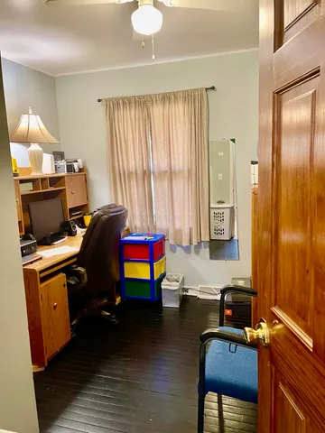 a room with furniture pool table and flat screen tv