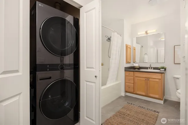 a view of a hallway with washer and dryer