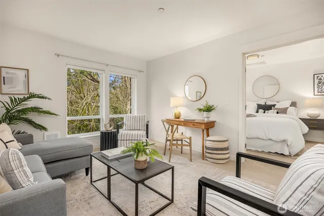 a living room with furniture and a large window