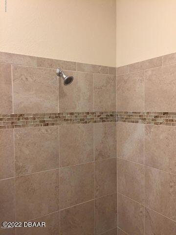 5435 Estero Loop Port Orange, FL 32128 - Photo 11 of 17 a bathroom with a shower