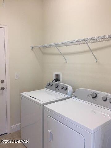 5435 Estero Loop Port Orange, FL 32128 - Photo 13 of 17 a utility room with dryer and washer