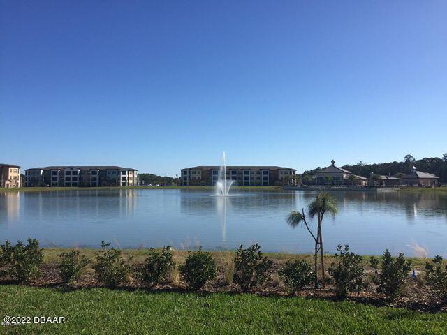 5435 Estero Loop Port Orange, FL 32128 - Photo 16 of 17 an aerial view of a house with a lake view