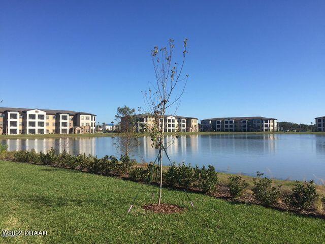 5435 Estero Loop Port Orange, FL 32128 - Photo 17 of 17 a view of a water pond with green space