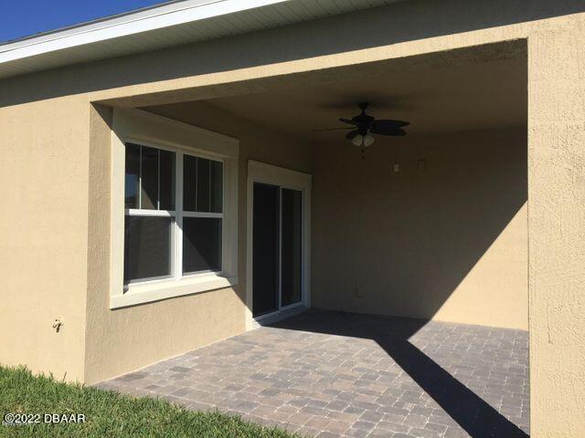 5435 Estero Loop Port Orange, FL 32128 - Photo 4 of 17 a view of a front door and a window