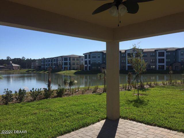 5435 Estero Loop Port Orange, FL 32128 - Photo 5 of 17 a view of a lake with a building in front of it