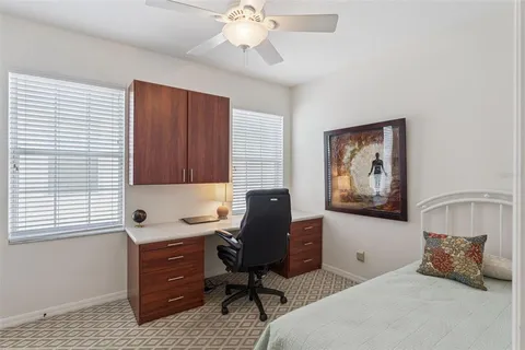 a bedroom with a workspace