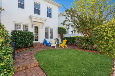 a view of a house with a backyard porch and sitting area