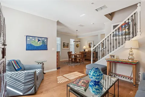 a living room with furniture and a rug