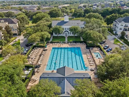 an aerial view of multiple houses with yard