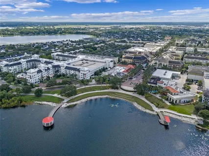 an aerial view of a city with a lake