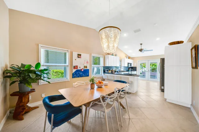 a dining room with furniture a livingroom and chandelier