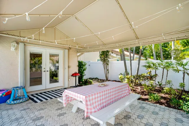 a bedroom with a bed and a potted plant