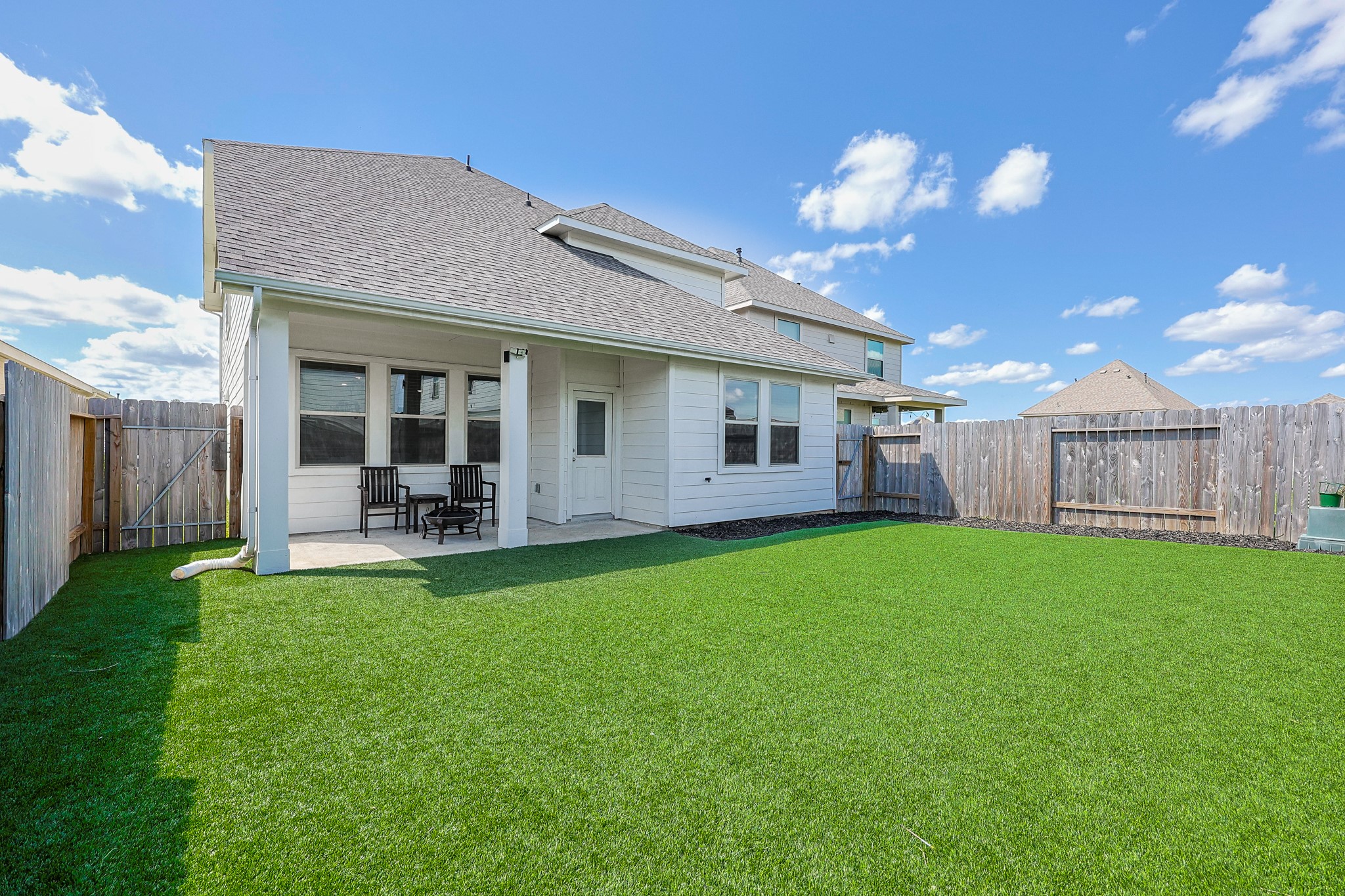10423 Rochester Hls Lane Tomball, TX 77375 - Photo 32 of 36 This stunning turf backyard stays a picture-perfect emerald green all 12 months of the year. It provides a clean, durable, and completely pristine surface that is always ready for pets, play, and parties.