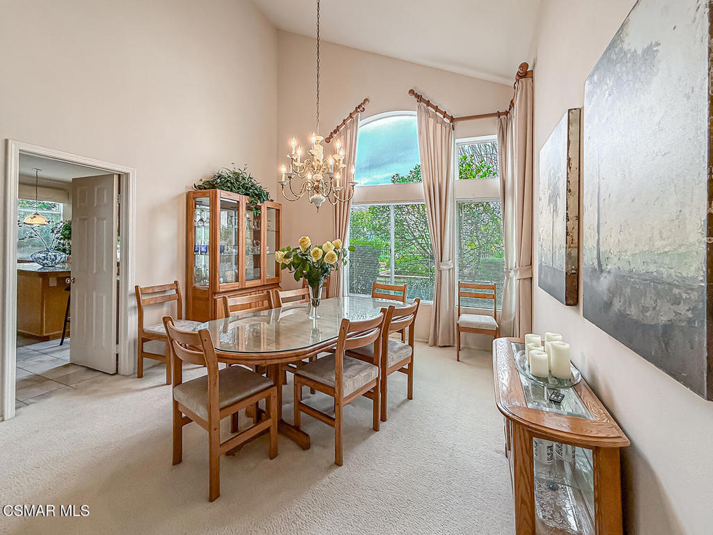 260 Sycamore Ridge Street Simi Valley, CA 93065 - Photo 14 of 58 a dining room with furniture a chandelier and fireplace