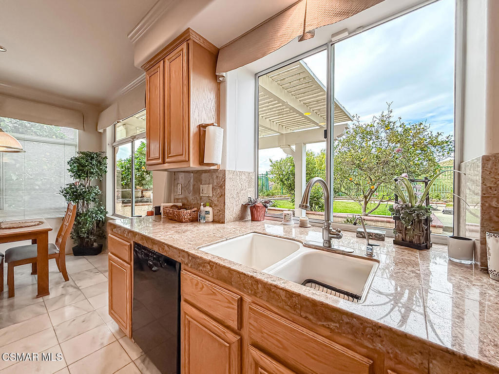 260 Sycamore Ridge Street Simi Valley, CA 93065 - Photo 26 of 58 a kitchen with a large window and a sink