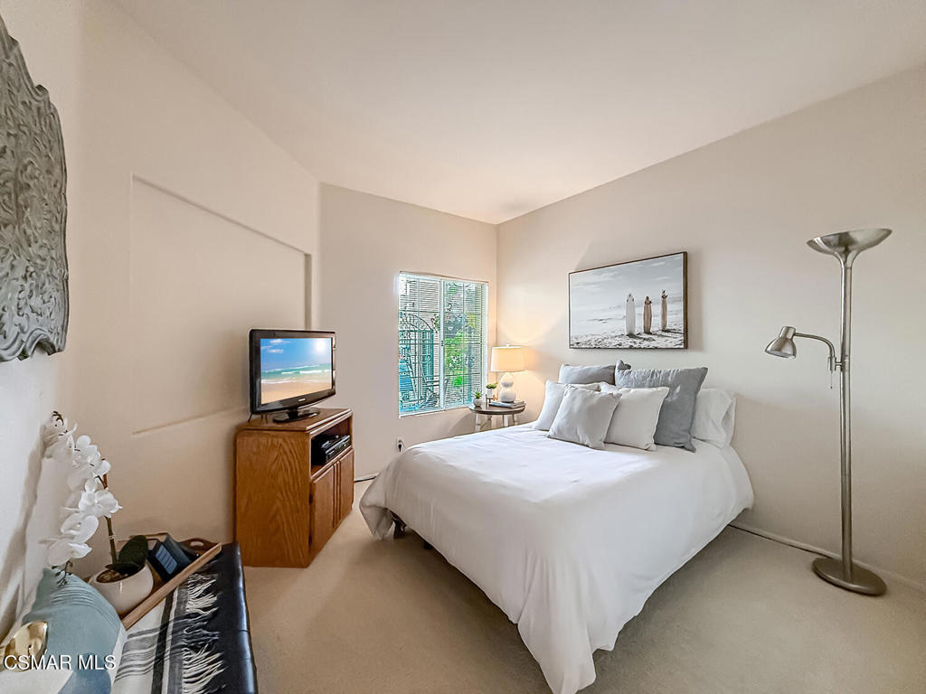 260 Sycamore Ridge Street Simi Valley, CA 93065 - Photo 27 of 58 a bedroom with a bed tv and a window