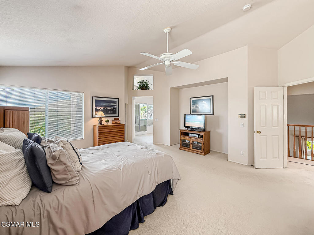 260 Sycamore Ridge Street Simi Valley, CA 93065 - Photo 34 of 58 a bedroom with bed and a chandelier